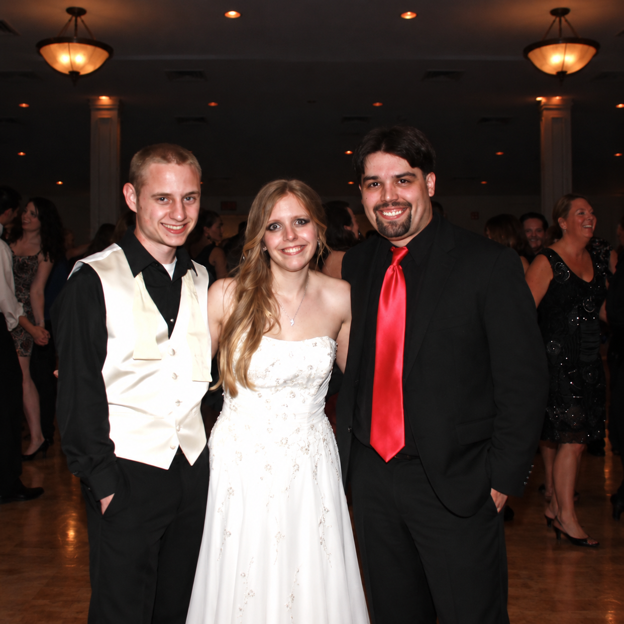 Mike from Magic Mike Entertainment with a bride and groom at a wedding reception