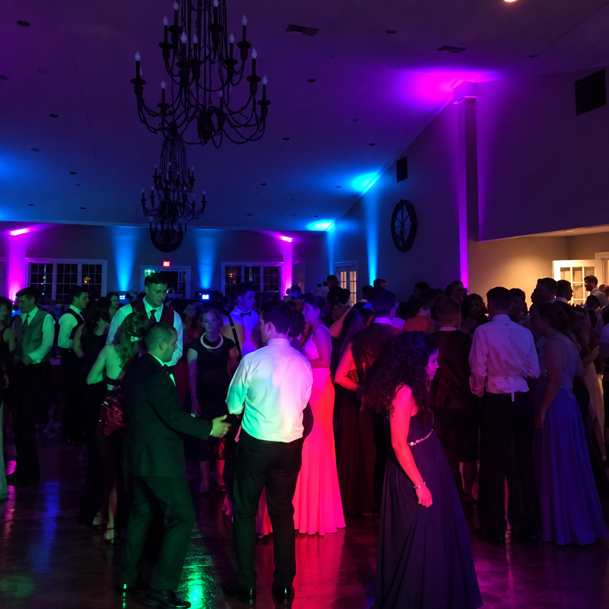 Guests dancing under event lighting at a Magic Mike Entertainment celebration
